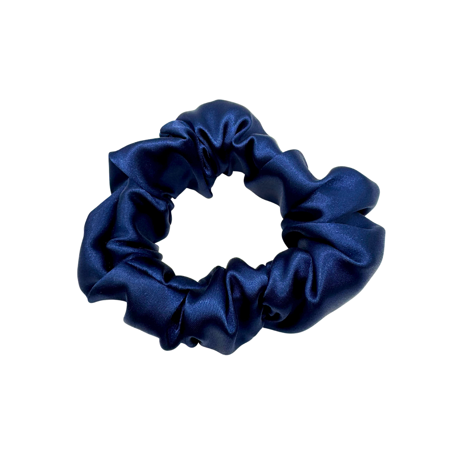 Deep navy satin scrunchie with a soft, luminous sheen and gently gathered folds. Handmade in Canada for a secure, damage-free hold and elegant everyday styling.