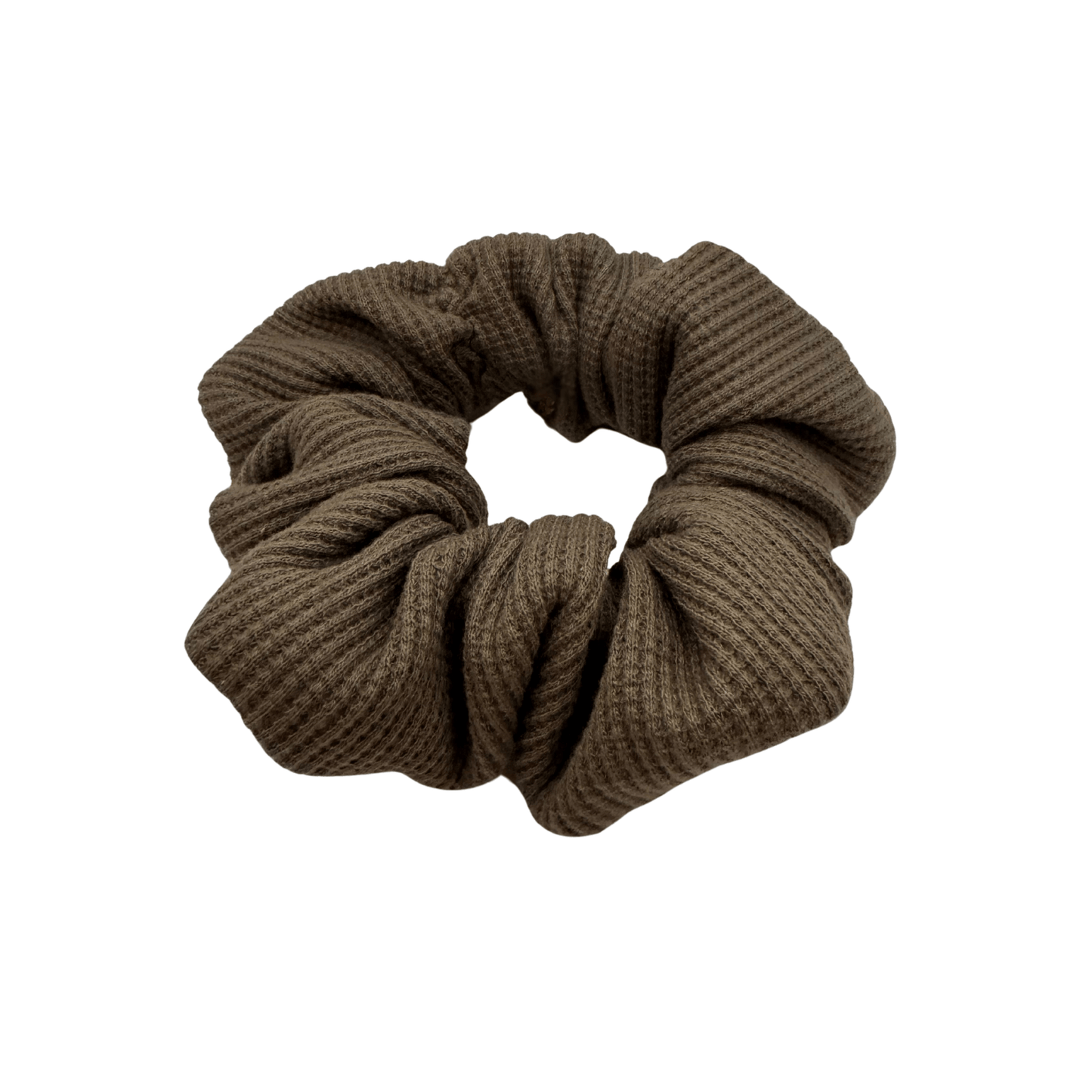 One XL brown waffle-knit cotton scrunchie. The textured fabric features a soft, ribbed pattern, offering a cozy and voluminous look. Ideal for gentle hair styling across different hair types and preferences