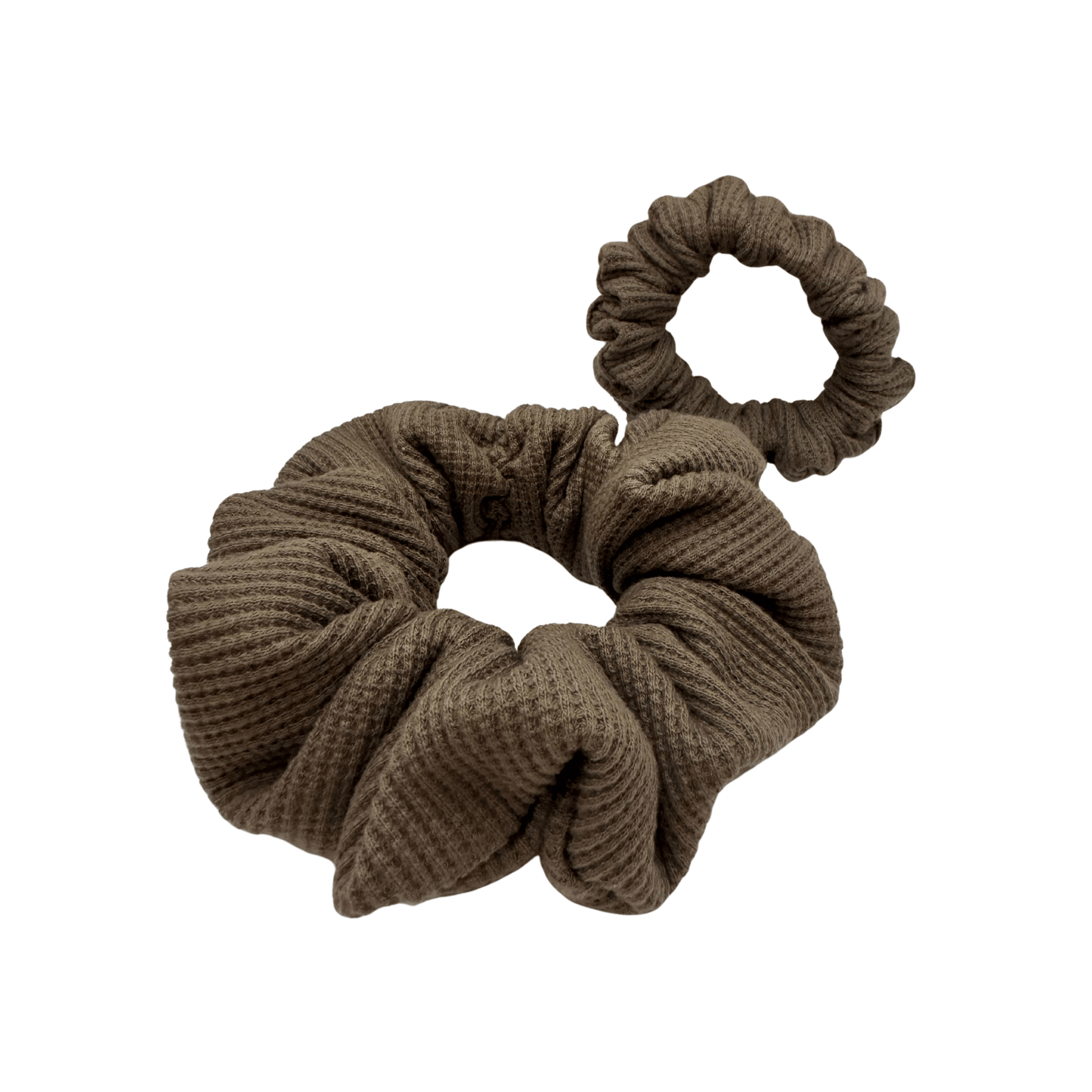 Set of two brown waffle-knit cotton scrunchies, one large and one small, displayed side by side. The textured fabric features a soft, ribbed pattern, offering a cozy and voluminous look. Ideal for gentle hair styling across different hair types and preferences