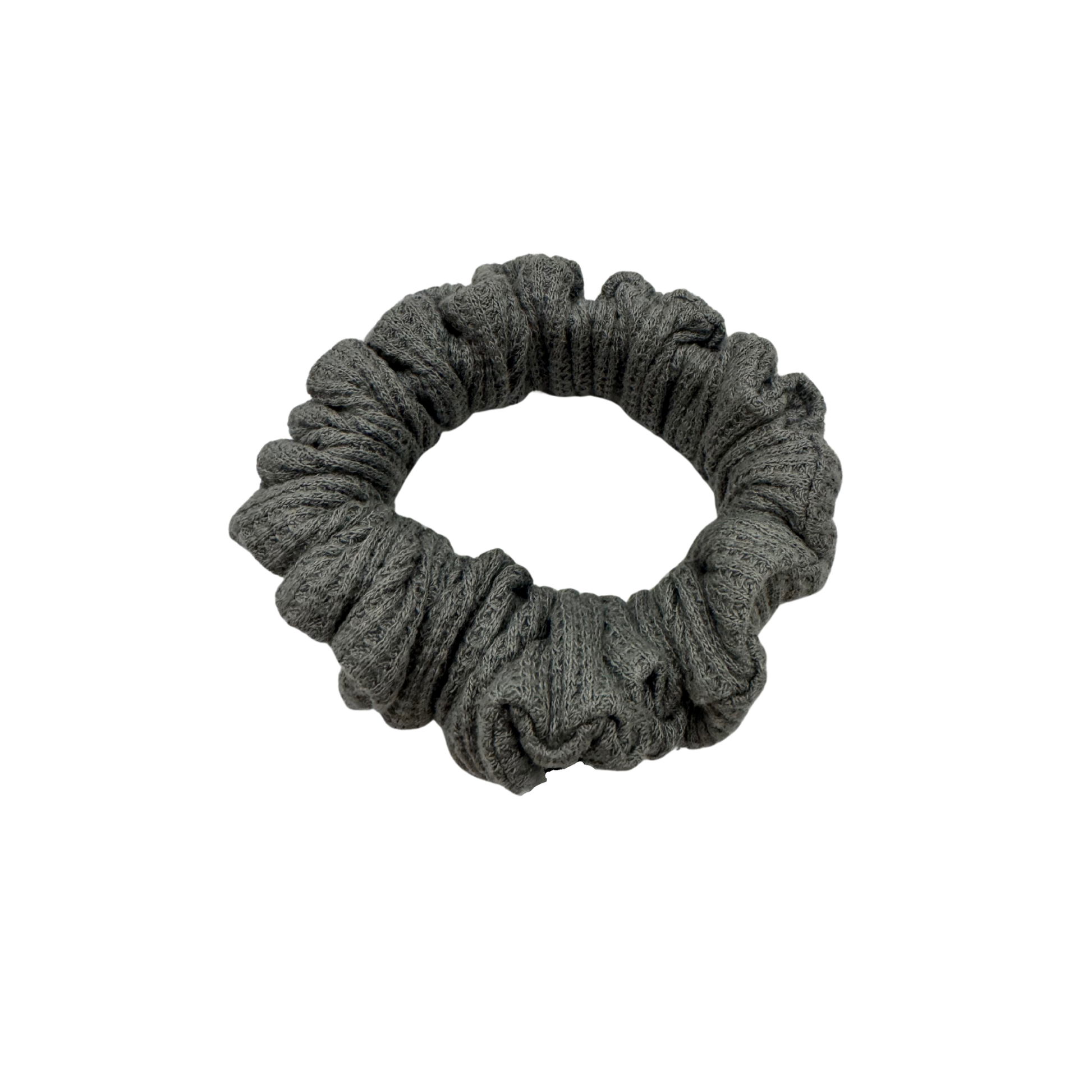 One grey waffle knit cotton scrunchie on a white background. Perfect for thick to medium hair, this scrunchie adds a touch of cozy soft elegance to any look.