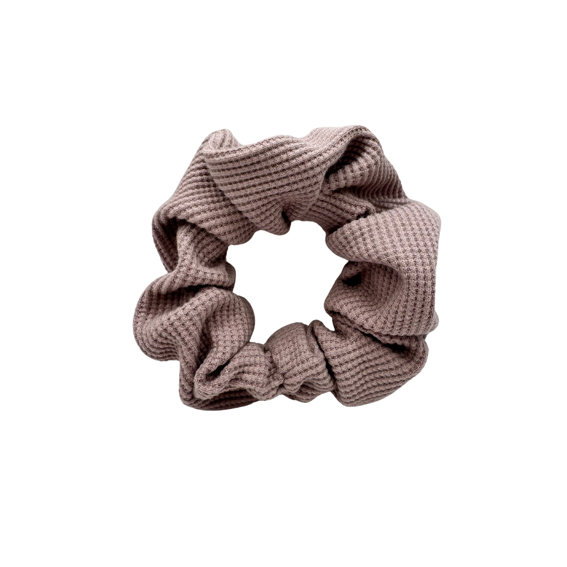 One Waffle Knit cotton scrunchie in muted mauve, styled in a circular shape with soft, gathered folds. Handmade and gentle on hair—ideal for cozy, everyday wear.
