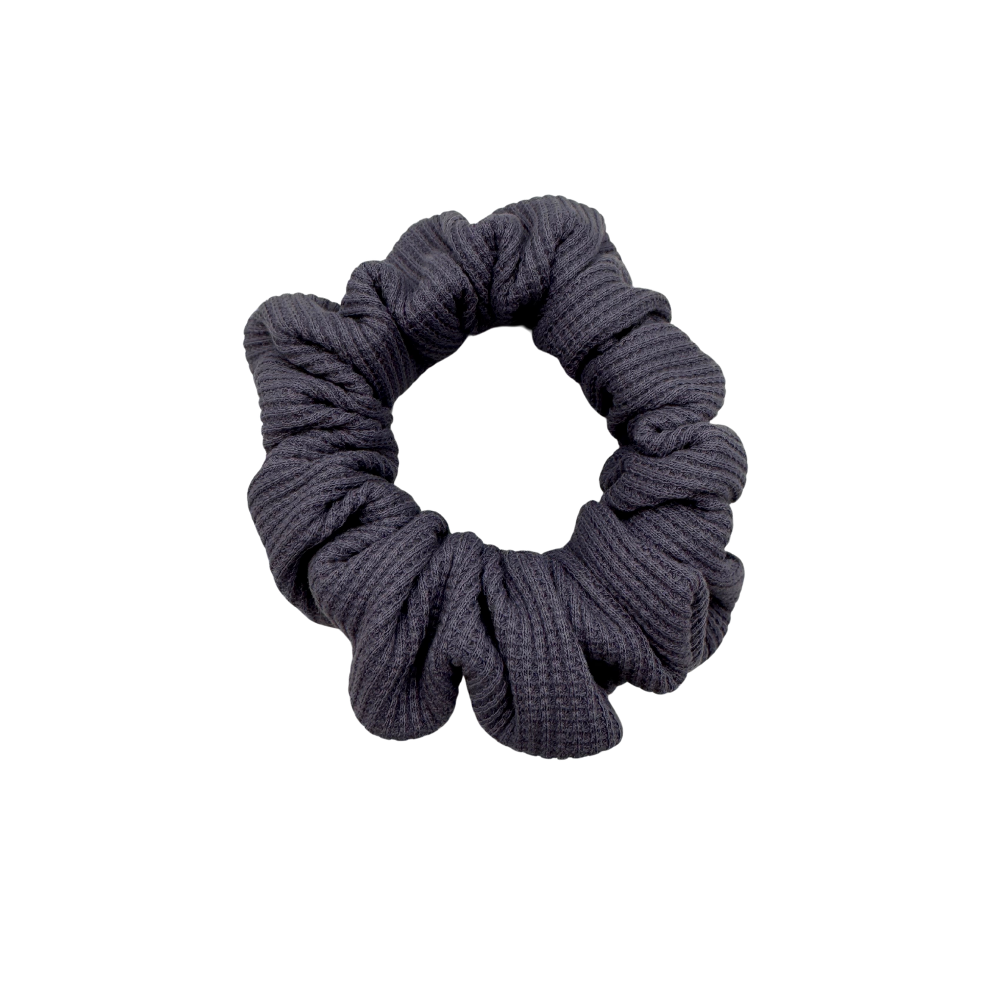 Plush waffle-knit cotton scrunchie in a rich purple hue, gathered into soft folds for visual charm and gentle volume. Handmade for a secure, damage-free hold and effortlessly graceful everyday styling.