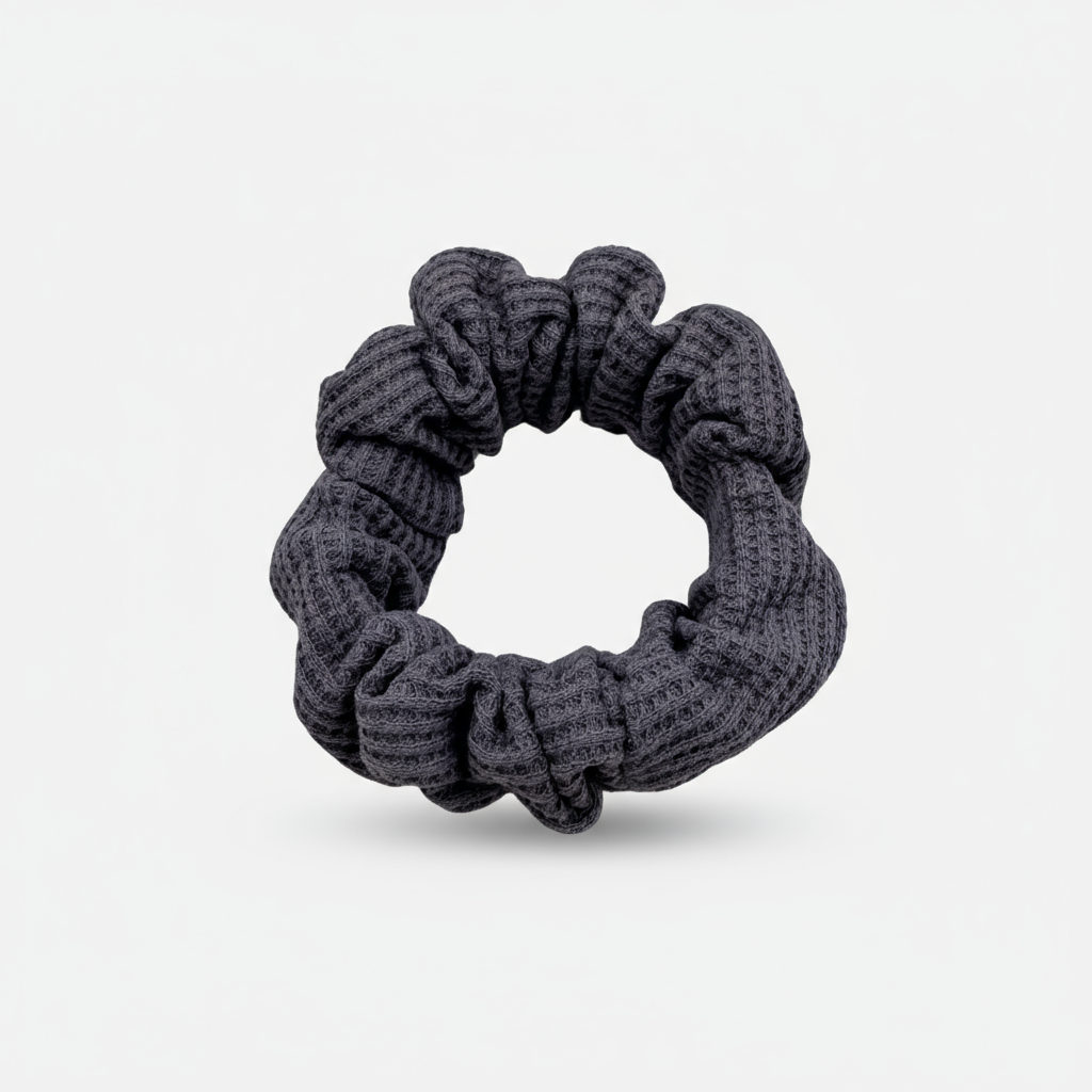 Plush waffle-knit cotton scrunchie in a rich purple hue, gathered into soft folds for visual charm and gentle volume. Handmade for a secure, damage-free hold and effortlessly graceful everyday styling.