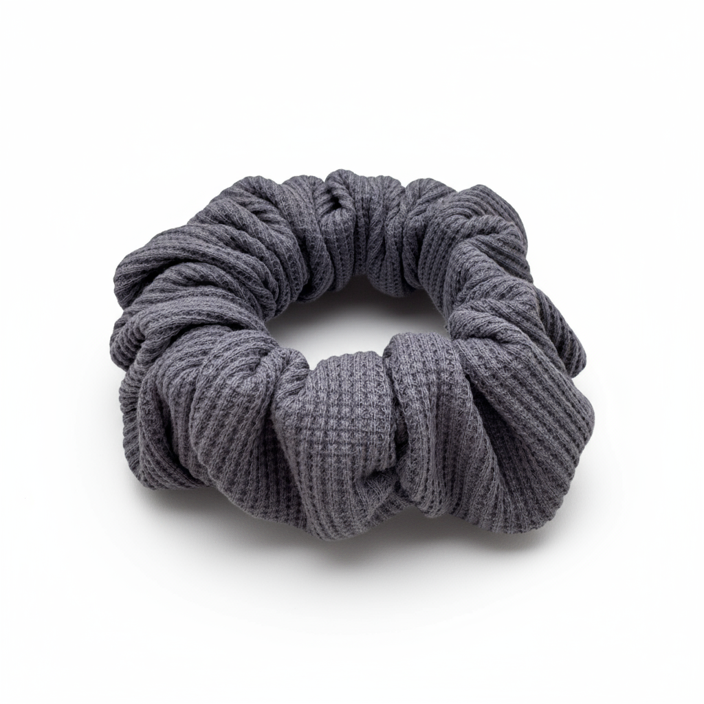 Plush waffle-knit cotton scrunchie in a rich purple hue, gathered into soft folds for visual charm and gentle volume. Handmade for a secure, damage-free hold and effortlessly graceful everyday styling.