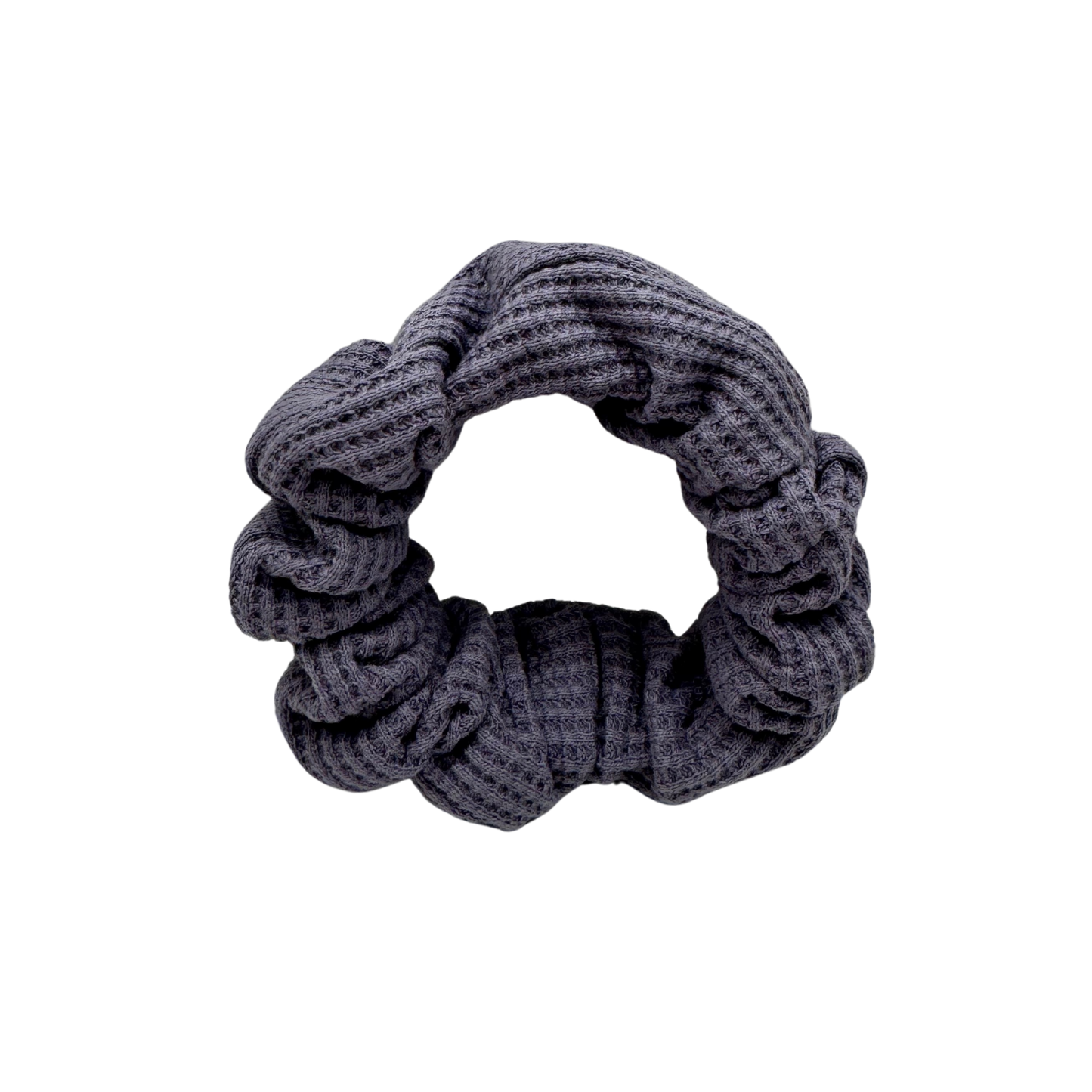 Plush waffle-knit cotton scrunchie in a rich purple hue, gathered into soft folds for visual charm and gentle volume. Handmade for a secure, damage-free hold and effortlessly graceful everyday styling.
