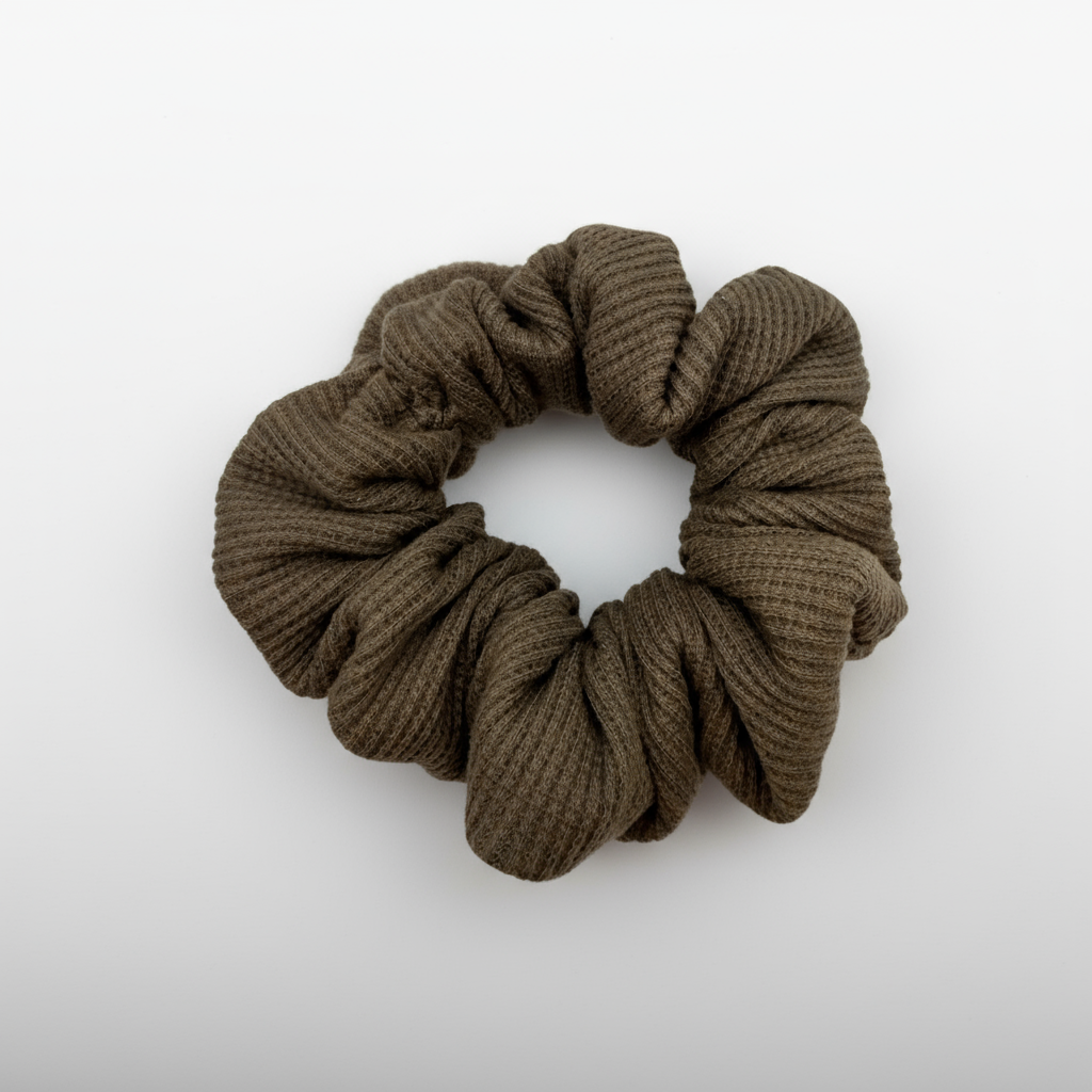 One XL brown waffle-knit cotton scrunchies.  The textured fabric features a soft, ribbed pattern, offering a cozy and voluminous look. Ideal for gentle hair styling across different hair types and preferences