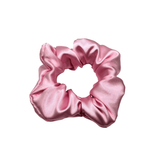 Baby pink satin scrunchie with a smooth, lustrous finish, arranged in soft ruffled folds. Handmade accessory designed for a gentle, secure hold and a timeless, elegant look.