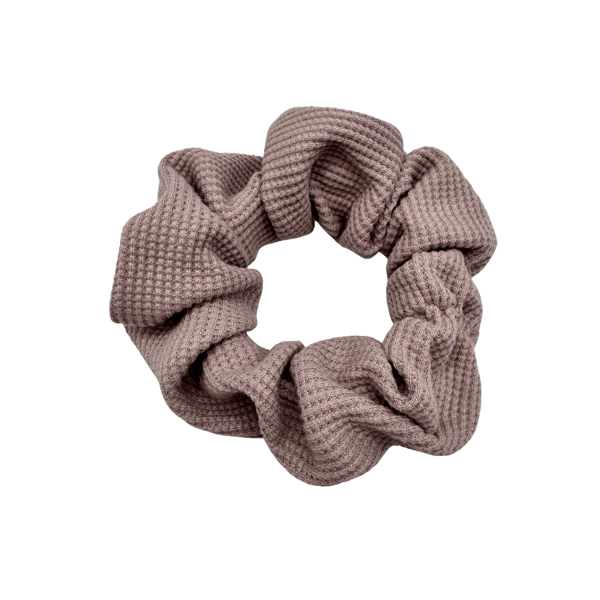 One Waffle Knit cotton scrunchie in muted mauve, styled in a circular shape with soft, gathered folds. Handmade and gentle on hair—ideal for cozy, everyday wear.