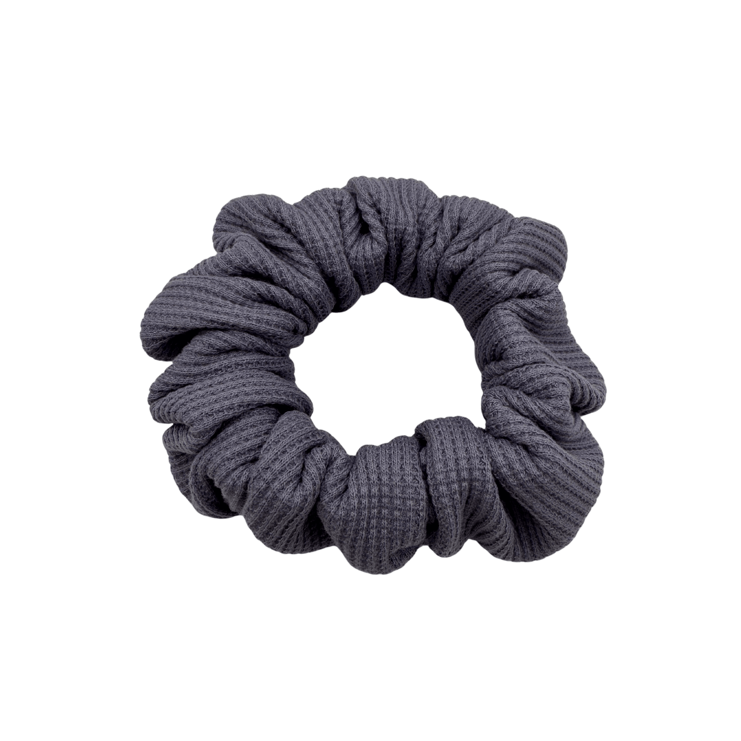 Plush waffle-knit cotton scrunchie in a rich purple hue, gathered into soft folds for visual charm and gentle volume. Handmade for a secure, damage-free hold and effortlessly graceful everyday styling.