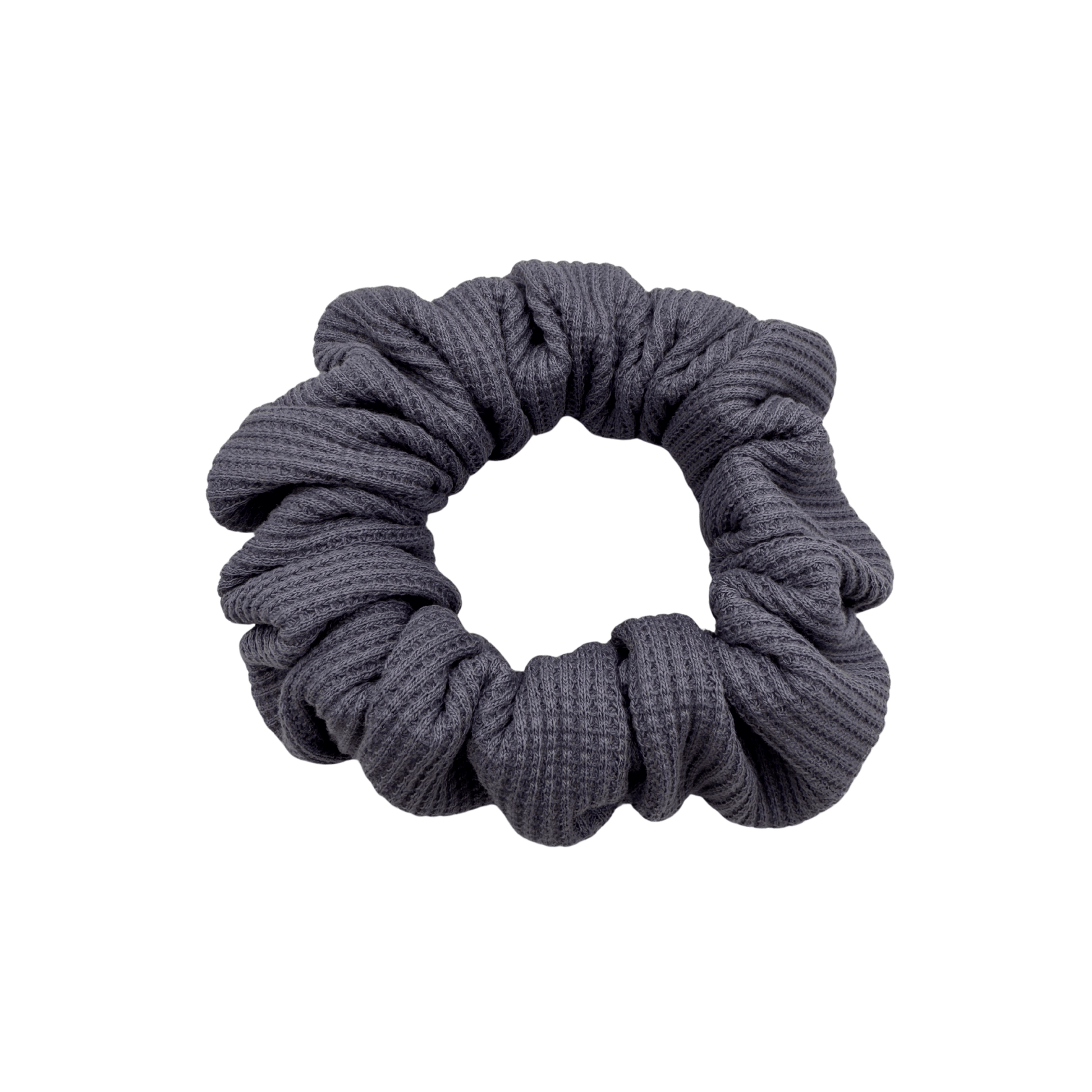Plush waffle-knit cotton scrunchie in a rich purple hue, gathered into soft folds for visual charm and gentle volume. Handmade for a secure, damage-free hold and effortlessly graceful everyday styling.