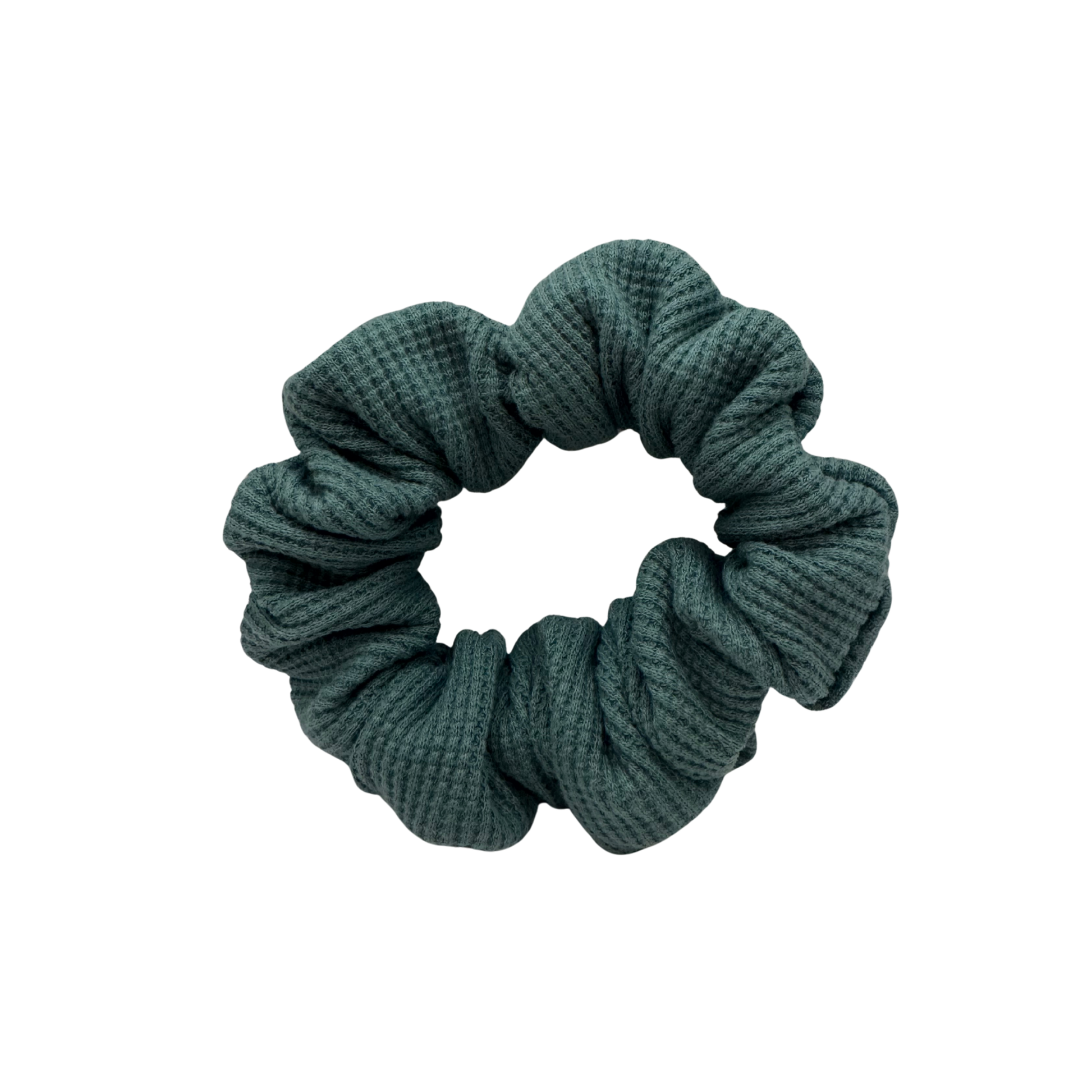 Teal textured scrunchie on a white background
