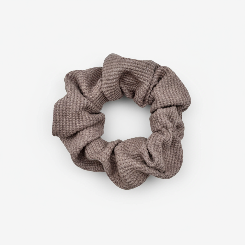 Waffle Knit cotton scrunchie in muted mauve, styled in a circular shape with soft, gathered folds. Handmade and gentle on hair—ideal for cozy, everyday wear.
