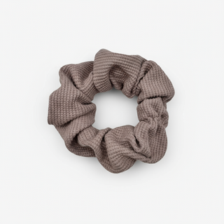 Waffle Knit cotton scrunchie in muted mauve, styled in a circular shape with soft, gathered folds. Handmade and gentle on hair—ideal for cozy, everyday wear.