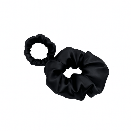 Black XL and Regular satin scrunchie with a smooth, glossy finish, gathered into soft ruffled folds. Handmade hair accessory designed for a gentle, secure hold and a sleek, timeless look.