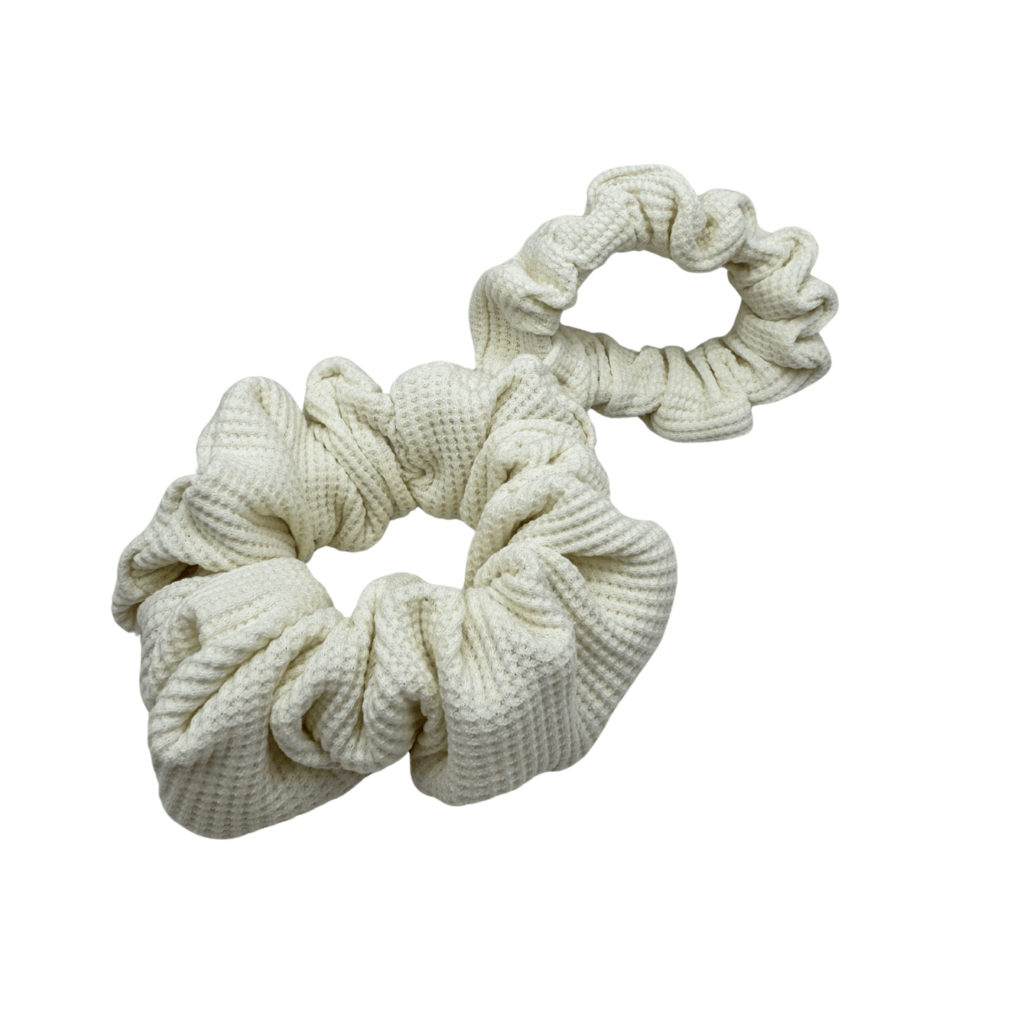 Two Ivory Waffle Knit Cotton scrunchies with soft, textured gathered folds. Handmade for secure hold and graceful everyday styling—ideal for thick or curly hair.