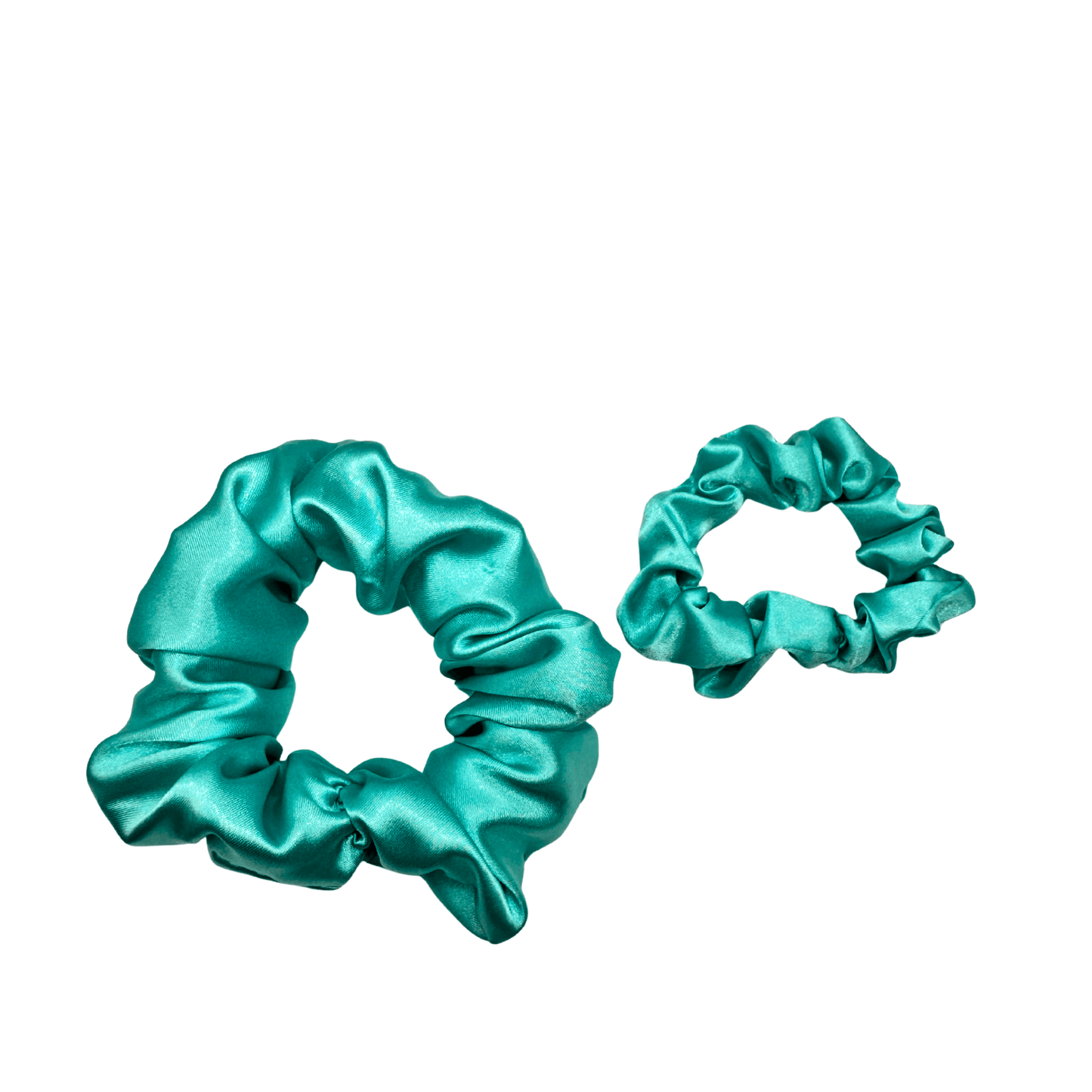 Ocean-blue satin scrunchie with a smooth, glossy finish and softly gathered folds. Handmade hair accessory designed for a gentle, secure hold and a serene, coastal-inspired look.
