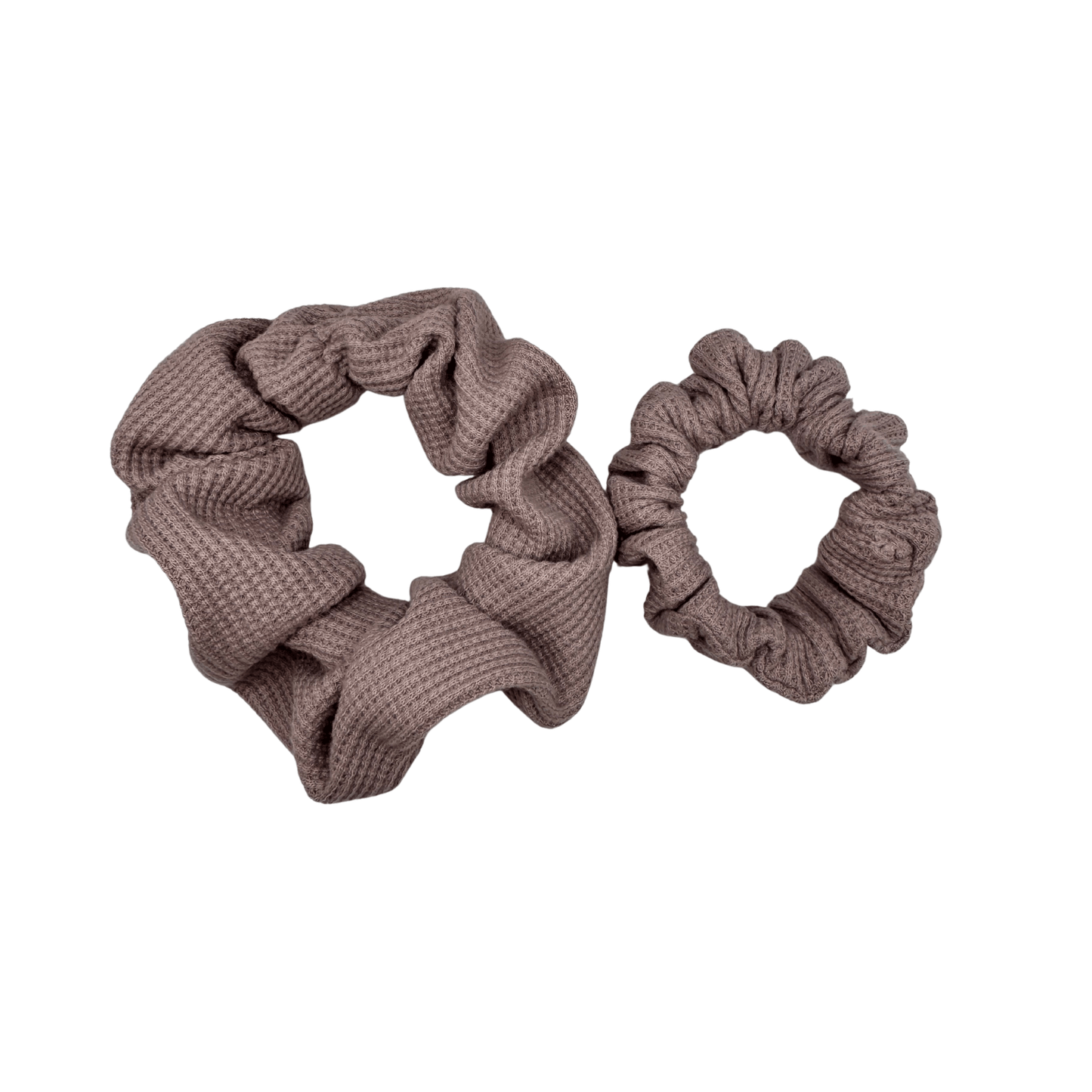 Two Waffle Knit cotton scrunchies in muted mauve, styled in a circular shape with soft, gathered folds. Handmade and gentle on hair—ideal for cozy, everyday wear.