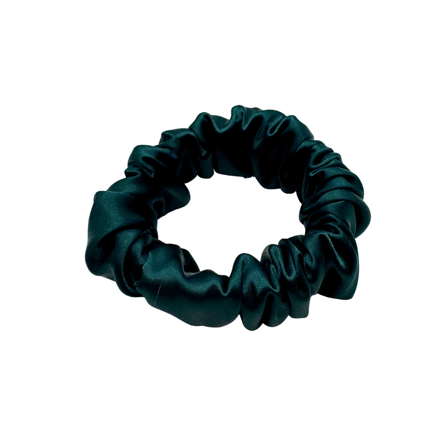 Emerald green satin scrunchie with a soft, luminous sheen and gently gathered folds. Handmade in Canada for elegant, damage-free styling and a secure, gentle hold.