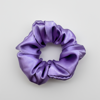 Purple satin scrunchie with a smooth, glossy finish and softly gathered folds. Handmade hair accessory designed for a gentle, secure hold and a romantic, celestial-inspired look.