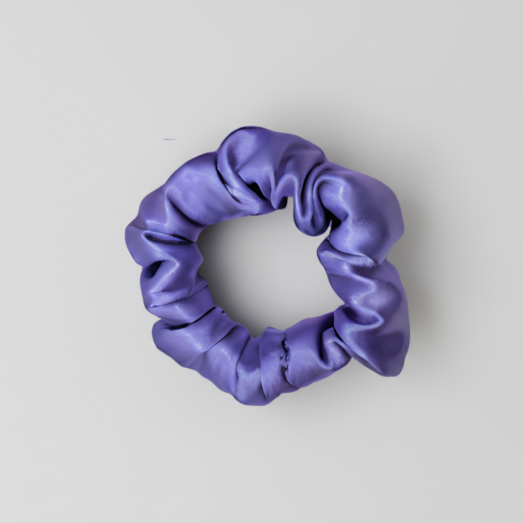Purple satin scrunchie with a smooth, glossy finish and softly gathered folds. Handmade hair accessory designed for a gentle, secure hold and a romantic, celestial-inspired look.