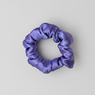 Purple satin scrunchie with a smooth, glossy finish and softly gathered folds. Handmade hair accessory designed for a gentle, secure hold and a romantic, celestial-inspired look.