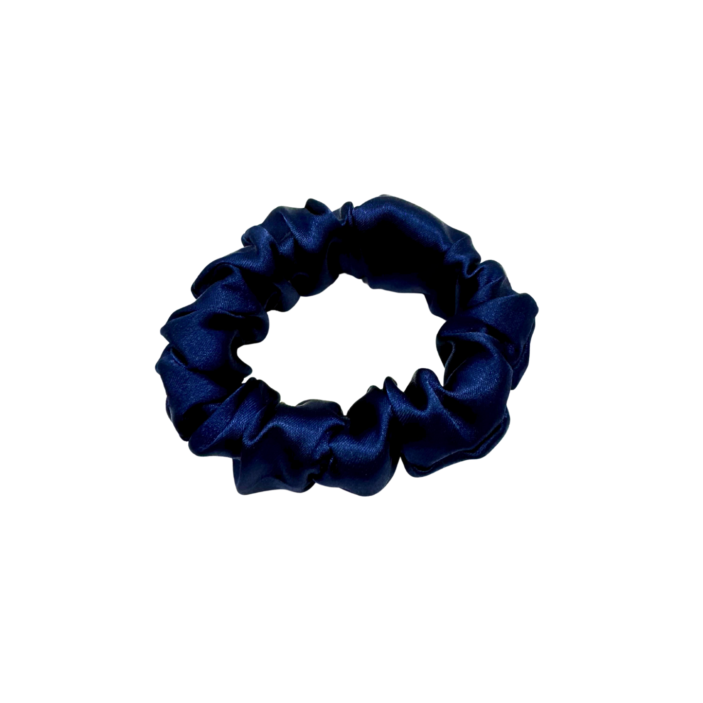 Deep navy satin scrunchie with a soft, luminous sheen and gently gathered folds. Handmade in Canada for a secure, damage-free hold and elegant everyday styling.