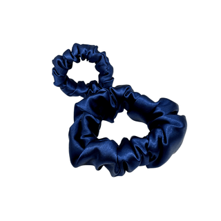 Two Deep navy satin scrunchie with a soft, luminous sheen and gently gathered folds. Handmade in Canada for a secure, damage-free hold and elegant everyday styling.