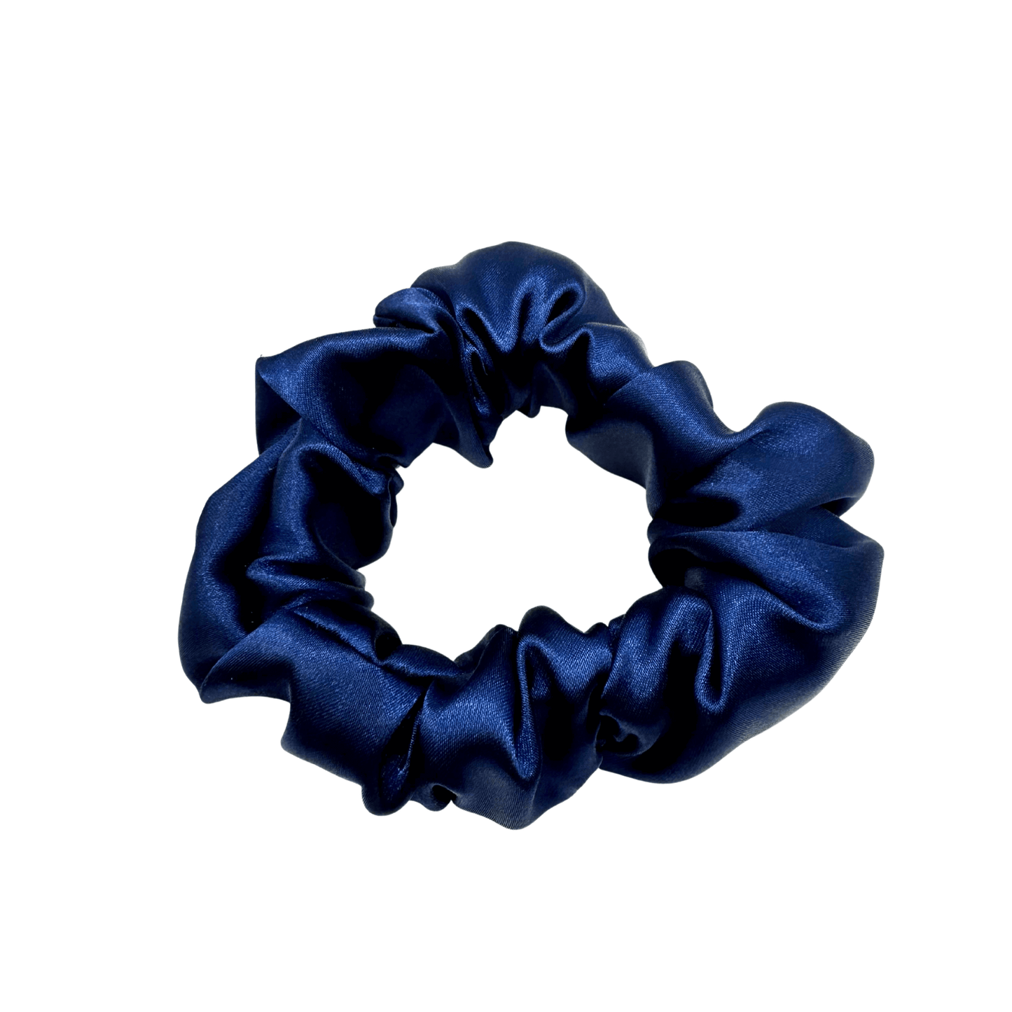 Deep navy satin scrunchie with a soft, luminous sheen and gently gathered folds. Handmade in Canada for a secure, damage-free hold and elegant everyday styling.